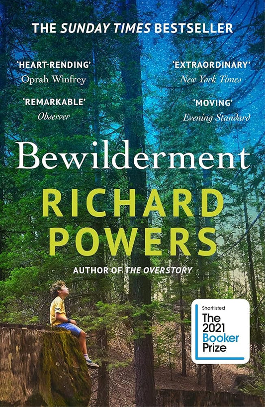 Cover of "Bewilderment" by Richard Powers, showing a child sitting on a tree stump in the middle of a forest.