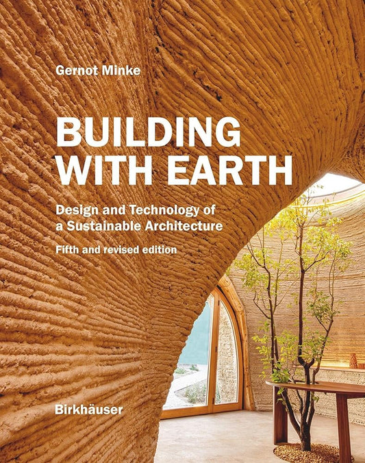 Cover of the book 'Building with Earth' showing an interior view of a earth-covered architectural structure with a tree and natural lighting.