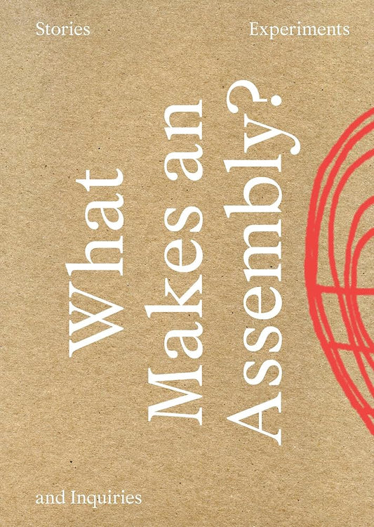The cover of the book titled 'What Makes an Assembly?' featuring text and geometric shapes in red on a beige background.