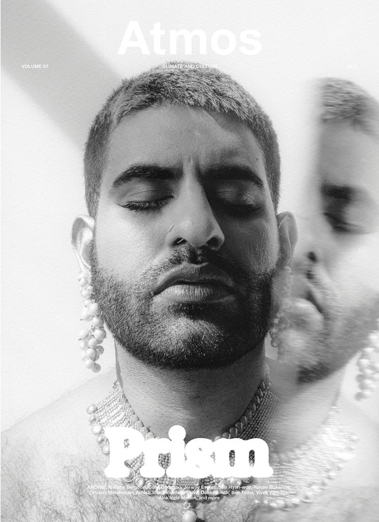 Black and white magazine cover with a person wearing jewelry and 'Atmos Prism' branding.