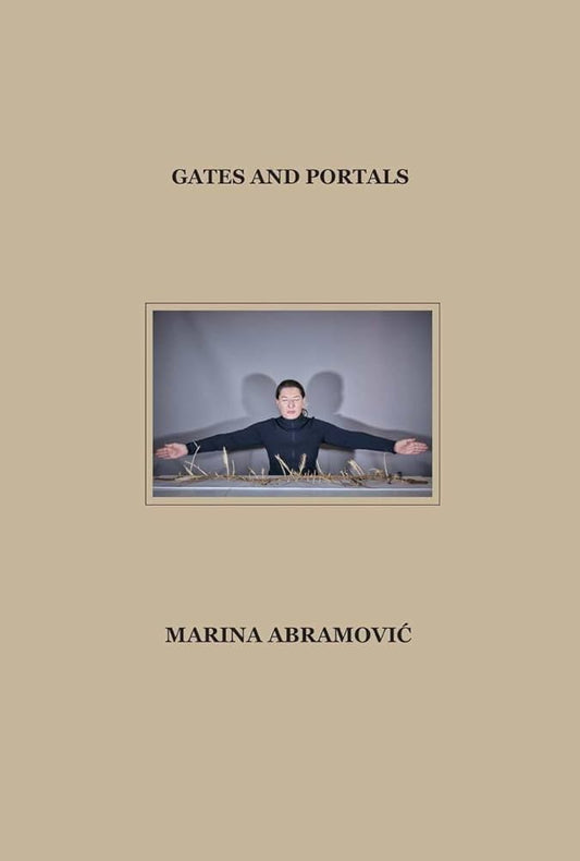 This image features the cover of a book titled "Gates and Portals" by Marina Abramovic. The cover design is minimalist, showcasing a monochrome photograph of the artist in a contemplative pose against a grey background.