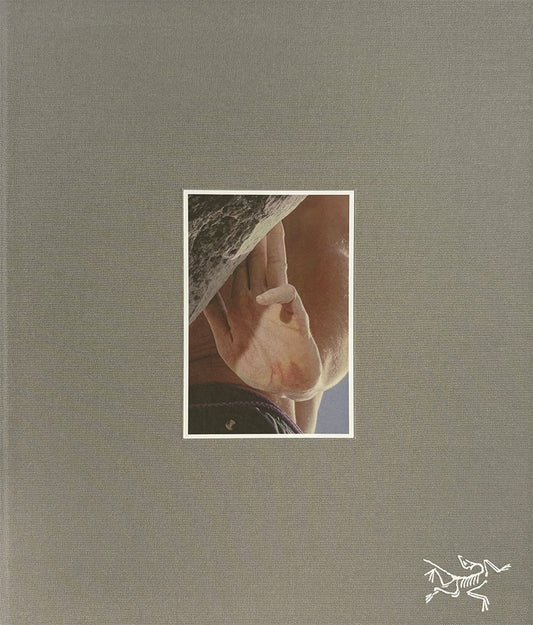 Book cover with a small inset photo of a climbers hand