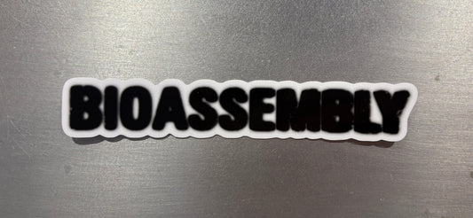 Sticker with 'BIOASSEMBLY' text on a metallic surface