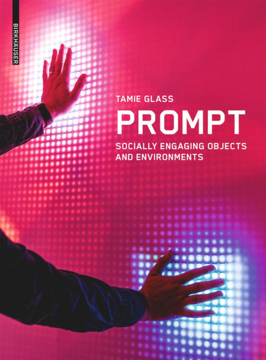 This image features the cover of the book titled "Prompt: Socially Engaging Objects and Environments." The cover design is vibrant and modern, with a close-up shot of a hand extended towards a brightly lit, holographic object.
