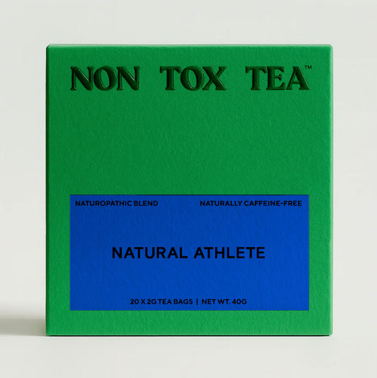 Green box of Non Tox Tea with 'Natural Athlete' label on a white background