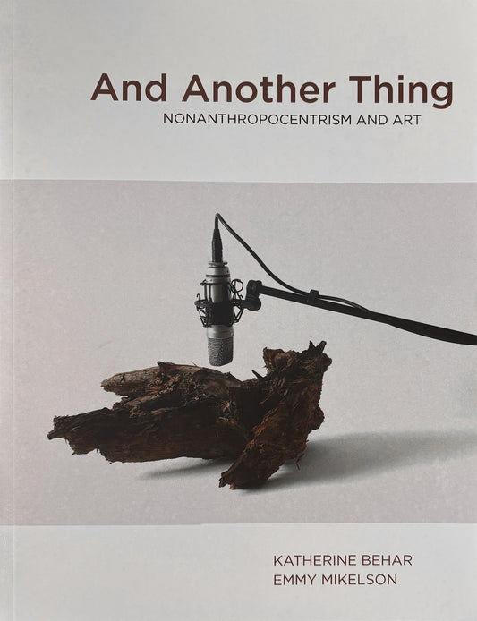Book cover of 'And Another Thing' with a microphone and wooden object on a gray background